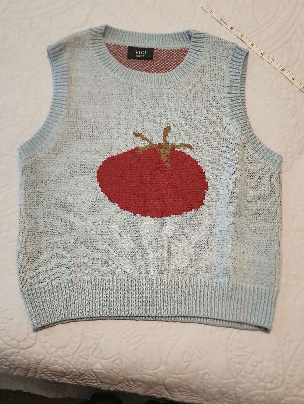 Red Tomato On Heathered Blue Sweater